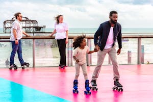 Family skating Brighton seaside